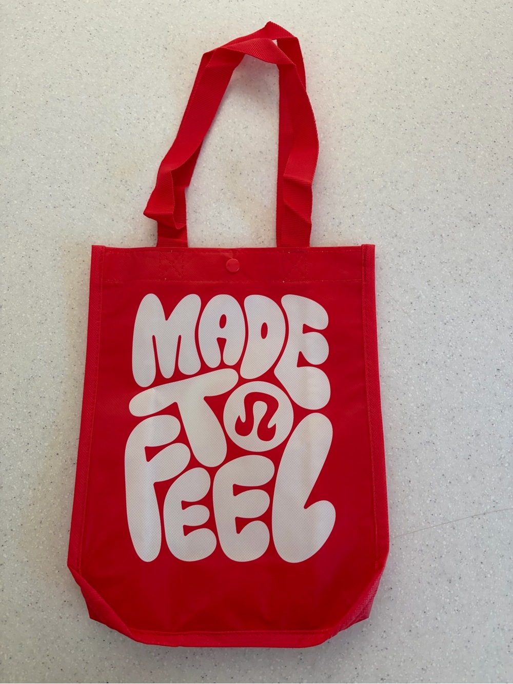 New lululemon athletica Red Tote with White 'Made to Feel' Graphic.